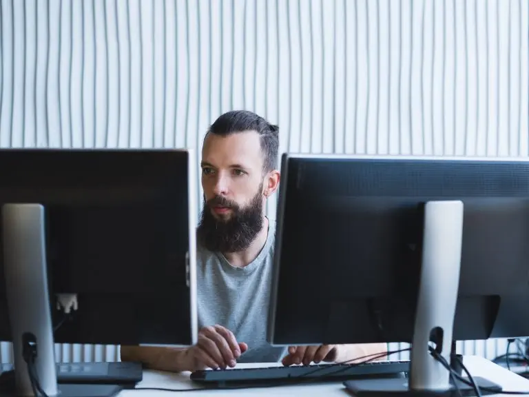 man working on computers