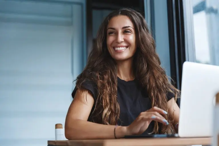smiling woman with laptop