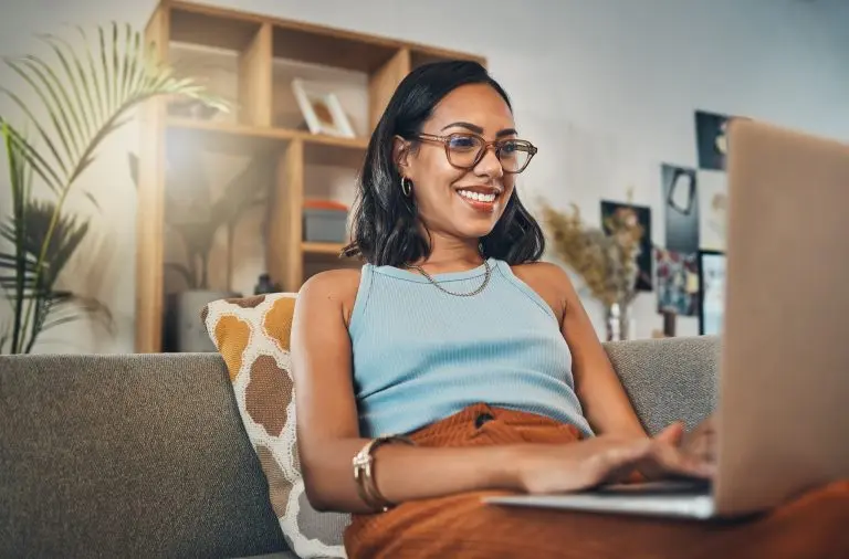 woman using laptop at home