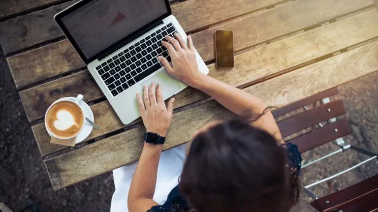 woman using laptop outdoors