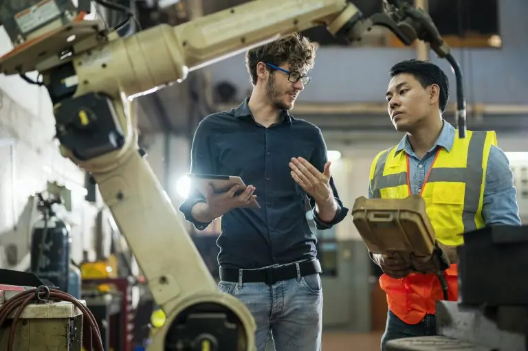 industrial workers with robotic arm