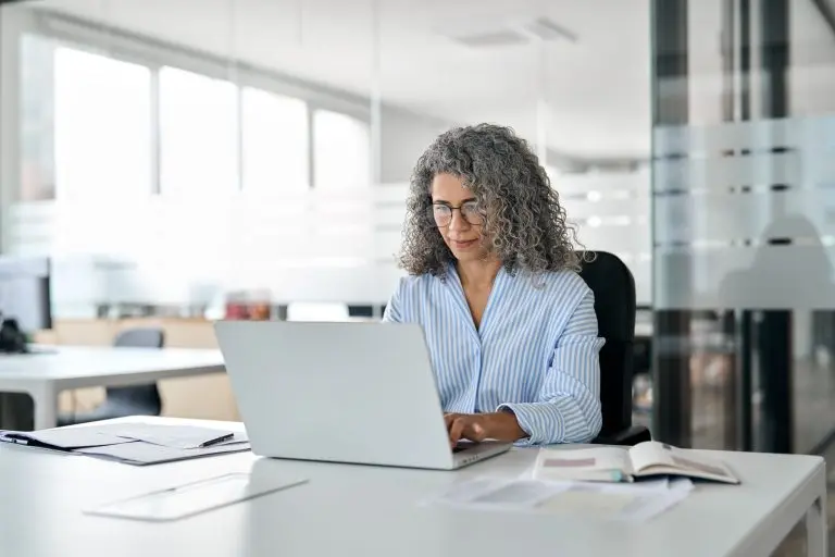 Woman working on laptop office